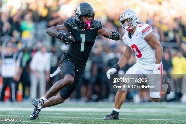 Wide receiver Traeshon Holden of the Oregon Ducks carries the ball during the first half of the game against the Ohio State Buckeyes at Autzen...