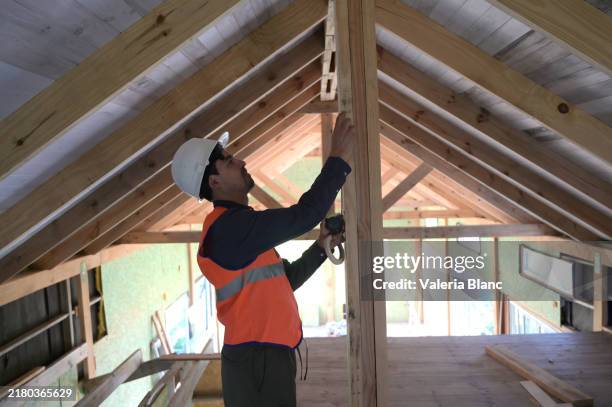 engineer on a construction site - attic stock pictures, royalty-free photos & images