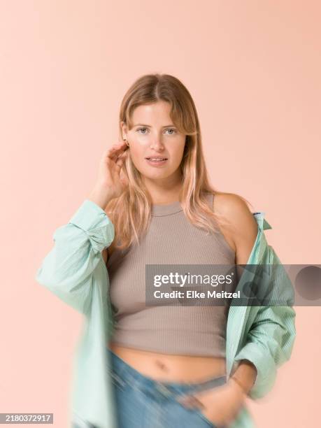 confident young woman - shivering stock pictures, royalty-free photos & images