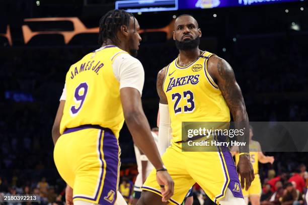 LeBron James and Bronny James of the Los Angeles Lakers react during the second quarter against the Minnesota Timberwolves at Crypto.com Arena on...