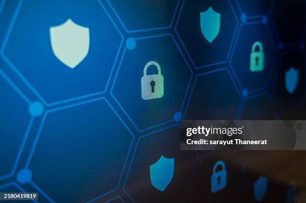 shield lock key pixel screen blue pixel locks. shield with key inside on blue background the concept of cybersecurity the internet - code blue stock pictures, royalty-free photos & images