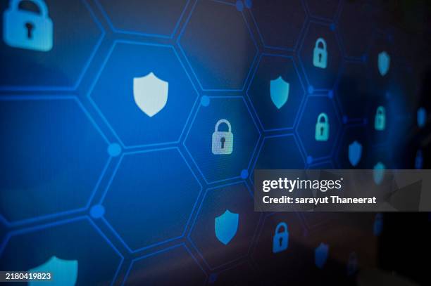 shield lock key pixel screen blue pixel locks. shield with key inside on blue background the concept of cybersecurity the internet - sécurité informatique photos et images de collection