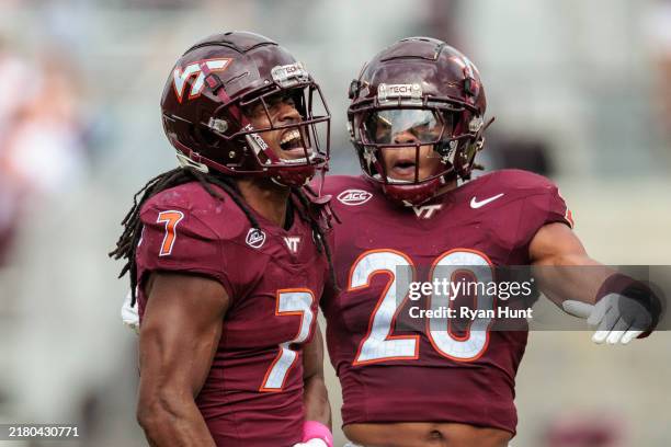 Keonta Jenkins and Caleb Woodson of the Virginia Tech Hokies react during the first half of the game against the Georgia Tech Yellow Jackets at Lane...