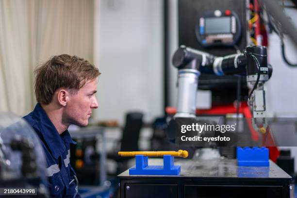 engineer is working and checking at robotics workshop. - electric motor stock pictures, royalty-free photos & images