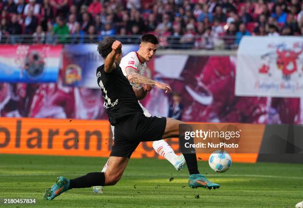 Benjamin Sesko of Leipzig shoots on goal during the Bundesliga match between RB Leipzig and SC Freiburg at Red Bull arena, Leipzig, Germany on...