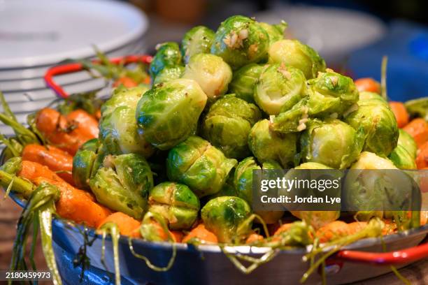 baby carrot and brussels sprouts - brussels sprout stock pictures, royalty-free photos & images