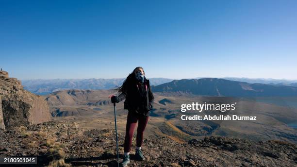 mountaineer woman poses for the camera at the top - freedom awards stock pictures, royalty-free photos & images