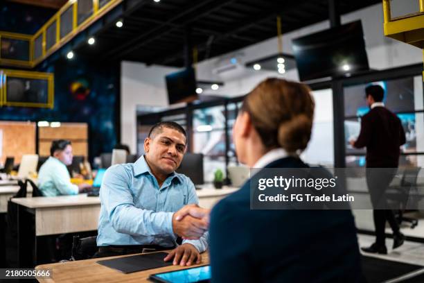 recruiter and candidate greeting each other during interview job at office - recrutamento imagens e fotografias de stock