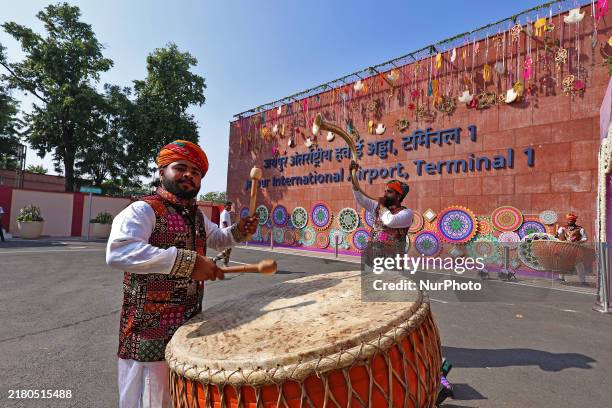 Folk artists perform during the newly renovated Jaipur International Airport Terminal 1 after its inauguration by Rajasthan Chief Minister Bhajanlal...