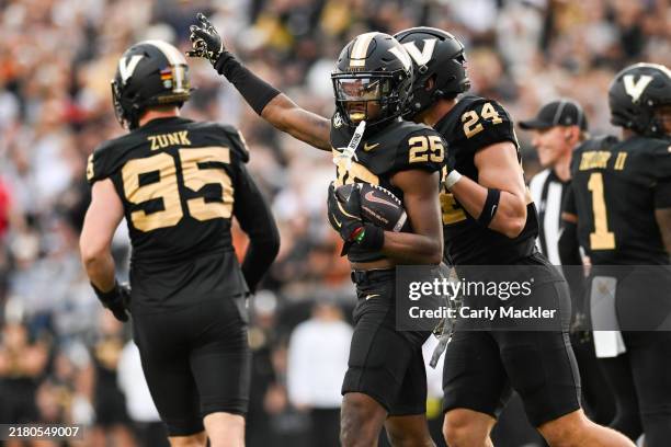 Martel Hight of the Vanderbilt Commodores indicates its their ball against the Texas Longhorns in the first half at FirstBank Stadium on October 26,...