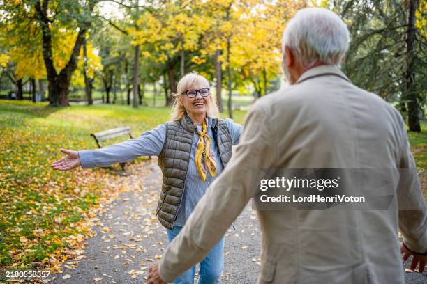 running to hug each other - reunite stock pictures, royalty-free photos & images