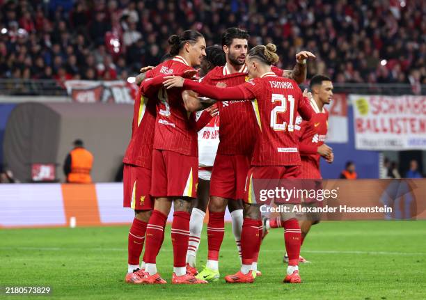 Darwin Nunez of Liverpool celebrates scoring his team's first goal with teammates Dominik Szoboszlai and Kostas Tsimikas during the UEFA Champions...