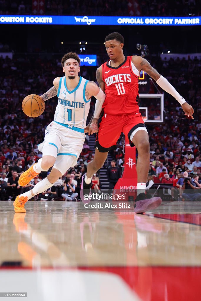 Hornets Rockets 2002 LaMelo Ball of the Charlotte Hornets dribbles against Jabari Smith ...