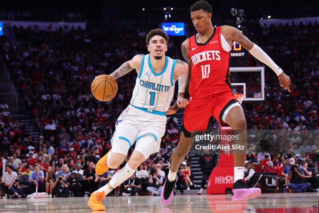 Hornets Rockets 2002 LaMelo Ball of the Charlotte Hornets dribbles against Jabari Smith ...