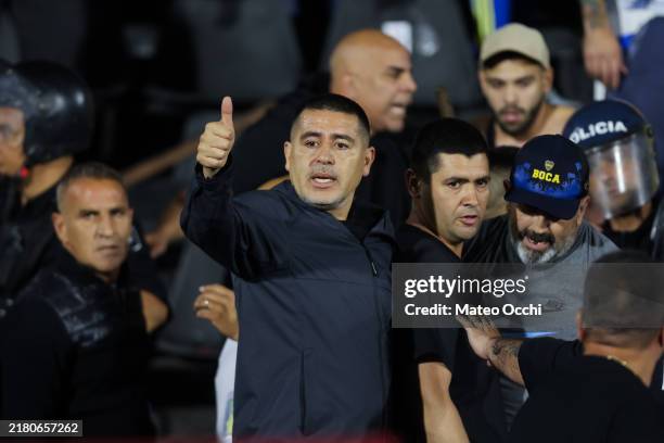 Juan Roman Riquelme, President of Boca Juniors gestures next to former player Raul Alfredo Cascini and member of the Boca Juniors' Soccer Council...