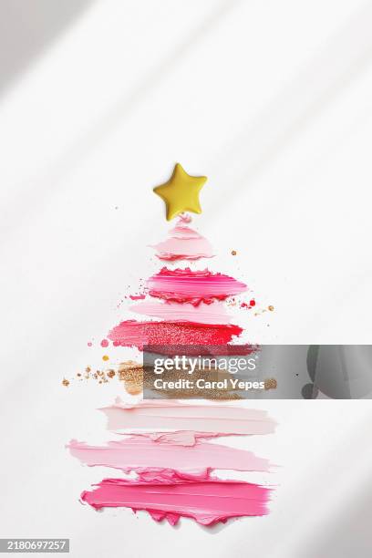 xmas tree made of lipstick swatches - snowflake drawing stock pictures, royalty-free photos & images