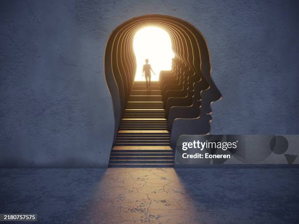 woman standing in the gate shaped of human head - brain stock pictures, royalty-free photos & images