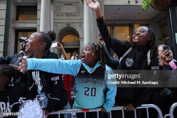 New York Liberty fans celebrate their WNBA championship during their parade on Broadway on October 24, 2024 in New York City. Fans lined the streets...