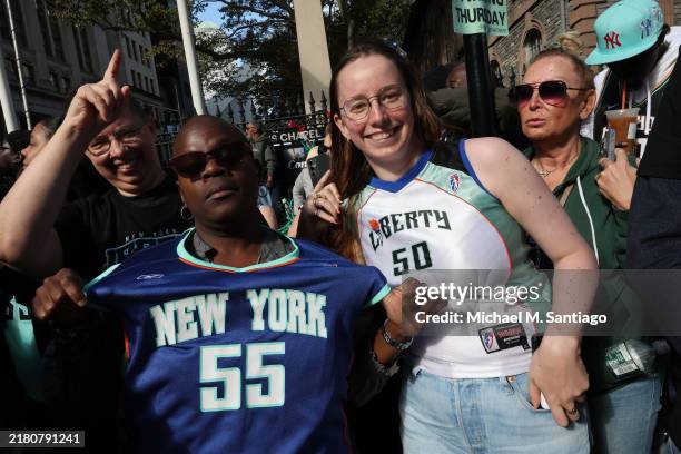 New York Liberty fans celebrate their WNBA championship during their parade on Broadway on October 24, 2024 in New York City. Fans lined the streets...