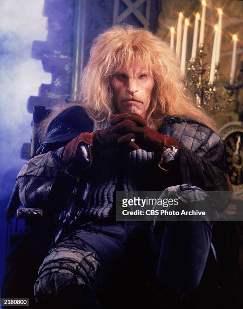 American actor Ron Perlman sits in makeup and costume in a promotional portrait for the television series, 'Beauty and the Beast,' c. 1988.