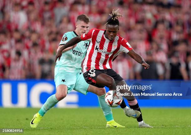 Nico Williams of Athletic Club controls the ball whilst under pressure from David Doudera of SK Slavia Praha during the UEFA Europa League 2024/25...