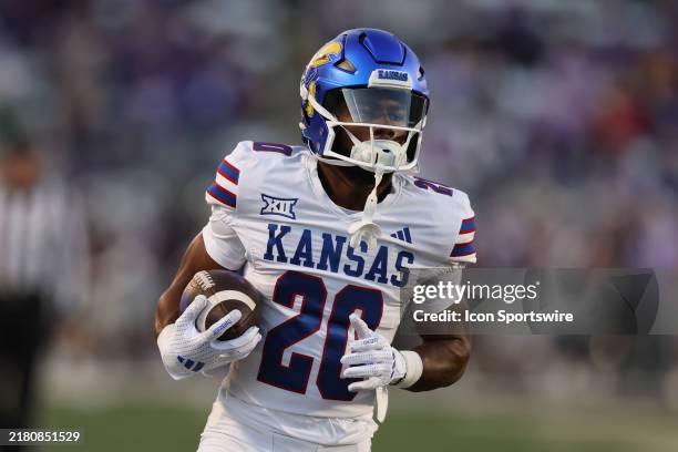 Kansas Jayhawks running back Johnny Thompson Jr. Runs with the ball before a Big 12 game between the Kansas Jayhawks and Kansas State Wildcats on...