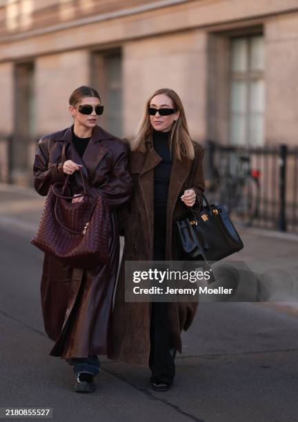 Sophia Geiss is seen wearing rimless oversized sunglasses with brown curved lenses with logo-embellishment, slim gold metal temples paired with the...
