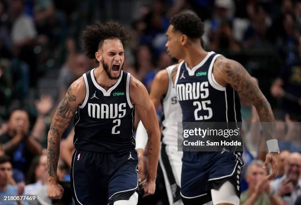 Dereck Lively II of the Dallas Mavericks celebrates after scoring alongside teammate P.J. Washington as they play the San Antonio Spurs in the fourth...