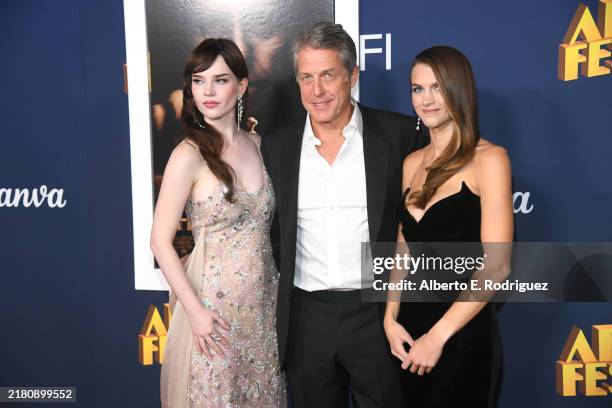 Sophie Thatcher, Hugh Grant and Chloe East attend the 2024 AFI Fest - Premiere Of "Heretic" at TCL Chinese Theatre on October 24, 2024 in Hollywood,...