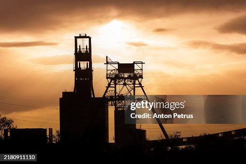 Coal mine buildings at sunset. Coal mining Coal mine buildings at sunset. Coal mining