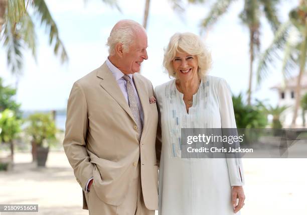 In this image released on October 27 King Charles III and Queen Camilla smile during a visit to a beach on October 25, 2024 in Apia, Samoa. The...