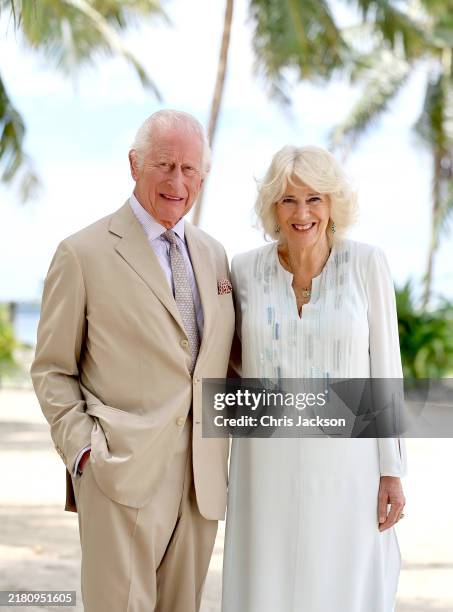 In this image released on October 26 King Charles III and Queen Camilla smile during a visit to a beach on October 25, 2024 in Apia, Samoa. The...