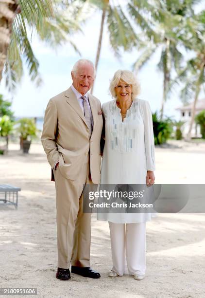 In this image released on October 26 King Charles III and Queen Camilla smile during a visit to a beach on October 25, 2024 in Apia, Samoa. The...