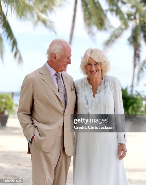 In this image released on October 27 King Charles III and Queen Camilla smile during a visit to a beach on October 25, 2024 in Apia, Samoa. The...