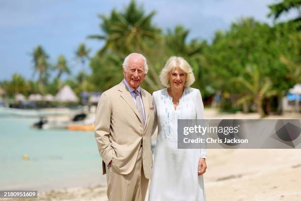 In this image released on October 26 King Charles III and Queen Camilla smile during a visit to a beach on October 25, 2024 in Apia, Samoa. The...