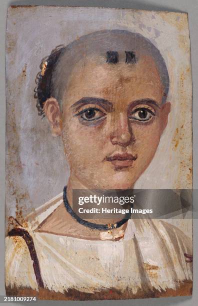 Mummy Portrait of a Youth, A.D. 150-200. A high infant mortality rate in Roman Egypt encouraged confidence in magical spells to ward off illness and...