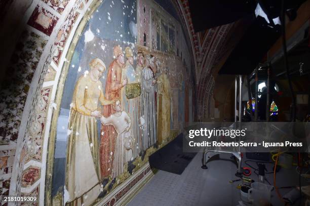 Restorers at work on the italian artist Giotto di Bondone frescos of the Life of San Francesco cycle at Bardi Chapel at Basilica di Santa Croce on...