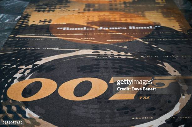 The Aston Martin DB12 Goldfinger Edition is pictured during the 007 takeover of Burlington Arcade on October 29, 2024 in London, England.