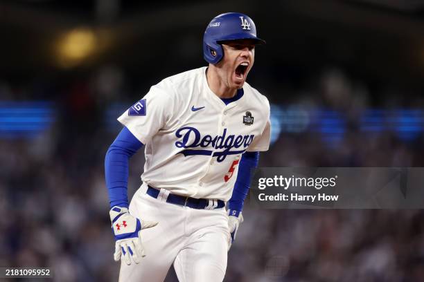 Freddie Freeman of the Los Angeles Dodgers celebrates after hitting a walk-off grand slam during the tenth inning against the New York Yankees during...