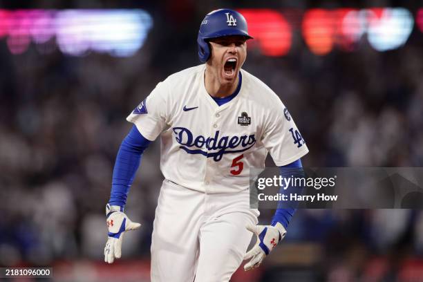 Freddie Freeman of the Los Angeles Dodgers celebrates after hitting a walk-off grand slam during the tenth inning against the New York Yankees during...