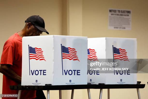 People cast their in-person early ballot for the 2024 general election at the Northwest Activities Center on October 29, 2024 in Detroit, Michigan.