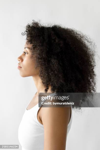 woman with afro hair side profile - dark skin tone stock pictures, royalty-free photos & images