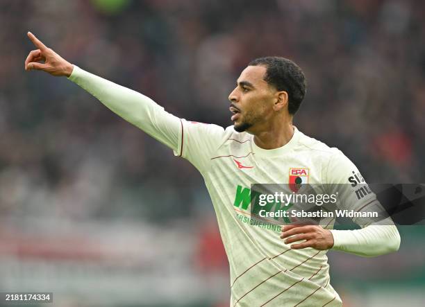 Alexis Claude-Maurice of FC Augsburg celebrates scoring his team's first goal during the Bundesliga match between FC Augsburg and Borussia Dortmund...