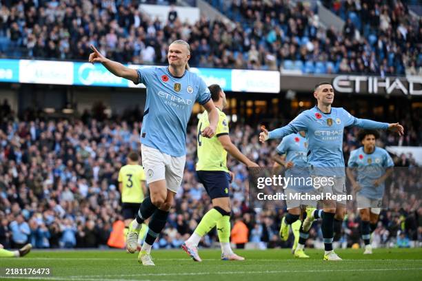 Erling Haaland of Manchester City celebrates scoring his team's first goal during the Premier League match between Manchester City FC and Southampton...