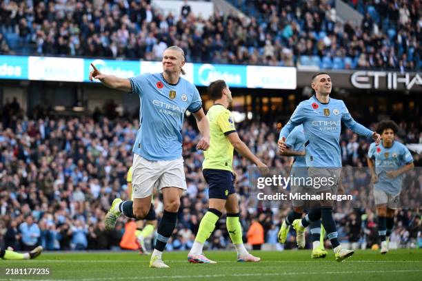 Erling Haaland of Manchester City celebrates scoring his team's first goal during the Premier League match between Manchester City FC and Southampton...