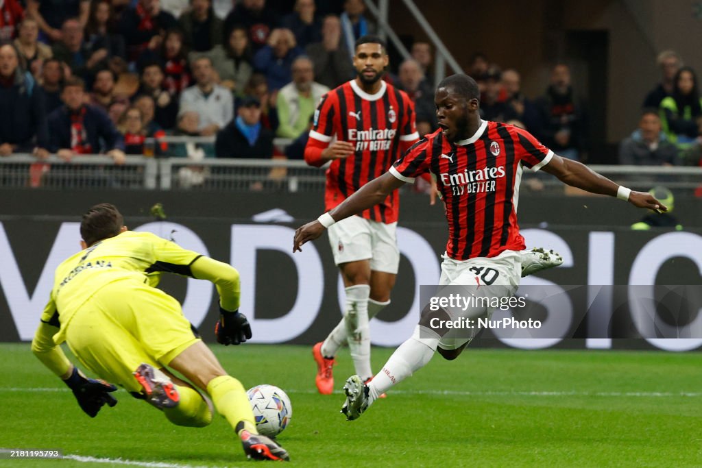 Tweki Napoli's Alex Meret makes a save against Milan's Yunus Musah during a ...