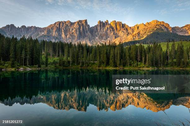 lago di carezza at sunrise - bolzano stock pictures, royalty-free photos & images