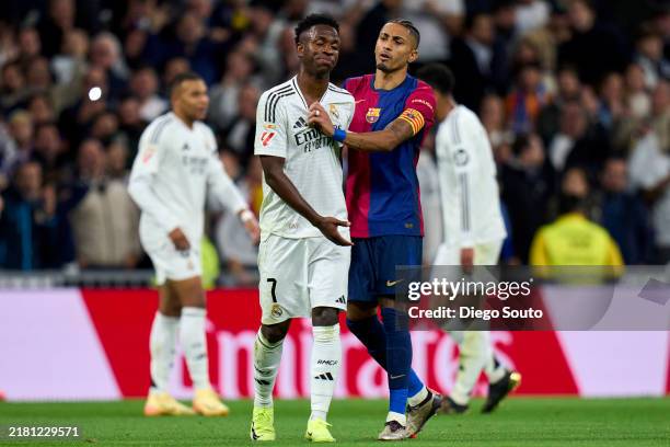 Vinicius Junior of Real Madrid CF argue with Raphinha of FC Barcelona during the LaLiga match between Real Madrid CF and FC Barcelona at Estadio...