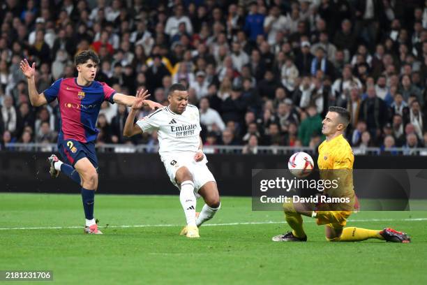Kylian Mbappe of Real Madrid has a shot saved by Inaki Pena of FC Barcelona during the LaLiga match between Real Madrid CF and FC Barcelona at...