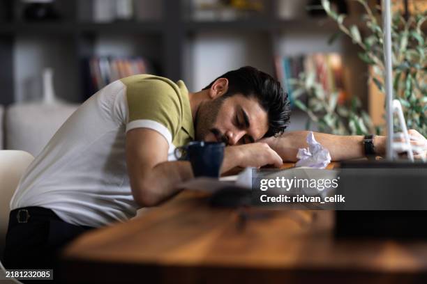 his work performance has taken a dive - man sleep table stock pictures, royalty-free photos & images
